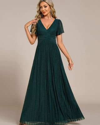 Plesové šaty s krátkými rukávy v nevšední petrolejové barvě. Šaty mají zajímavou látku, jsou prošité stříbrnou nitkou a...